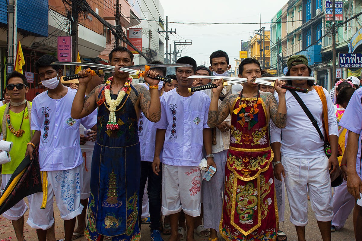 Phuket Vegetarian festival 2019 - Nine Emperor Gods religious ritual ceremony of body piercing mutilation with swords sharp object crackers