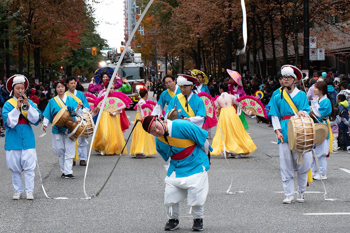 Vancouver, Canada - People go with drums and pipes - Halloween street parade 2019