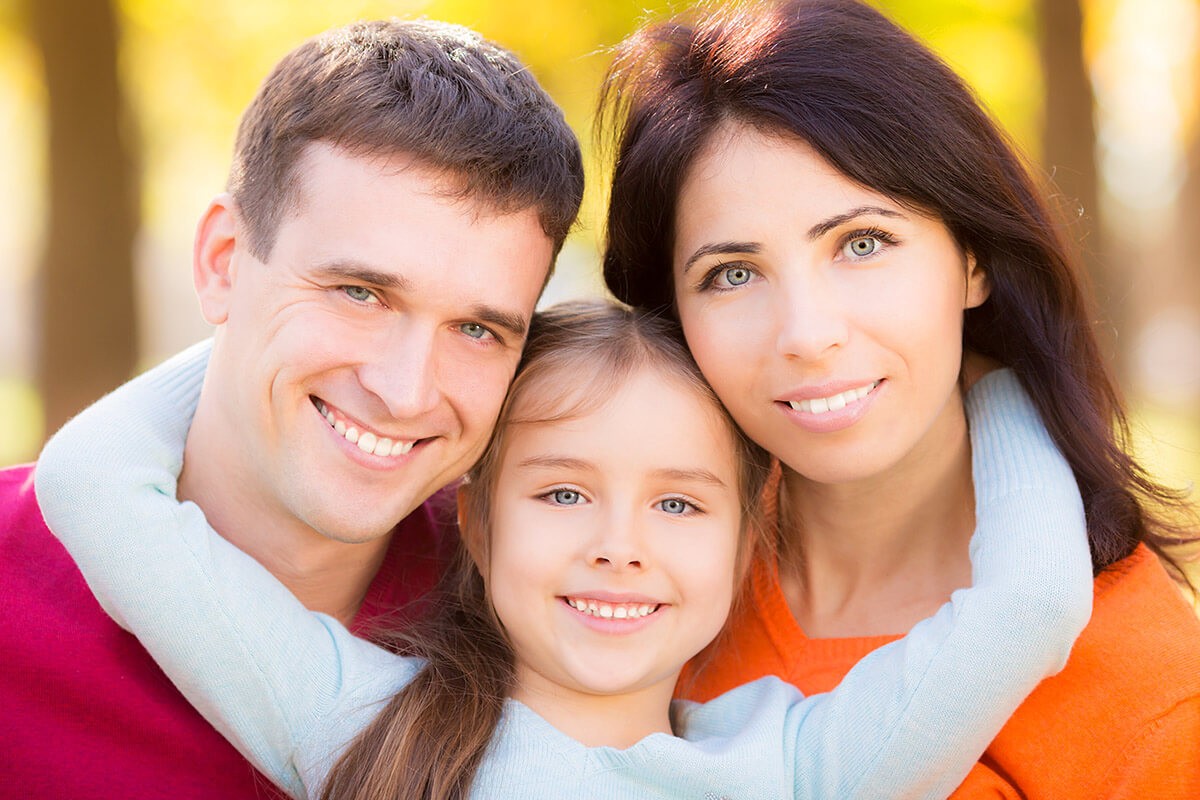 Happy married couple with a child
