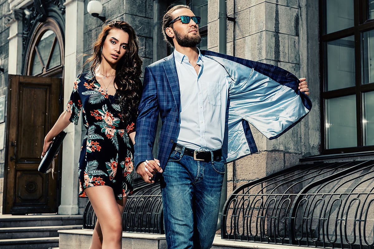 Man and woman walk together holding hands