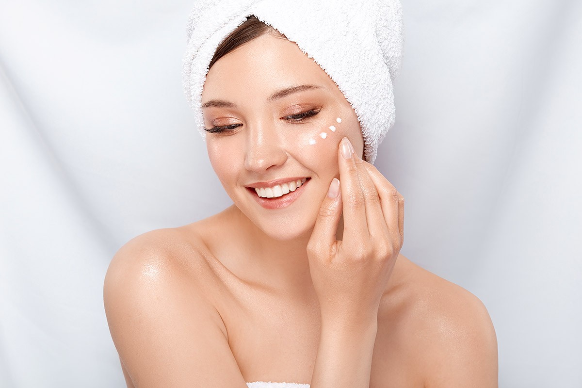 Woman removes makeup before going to bed