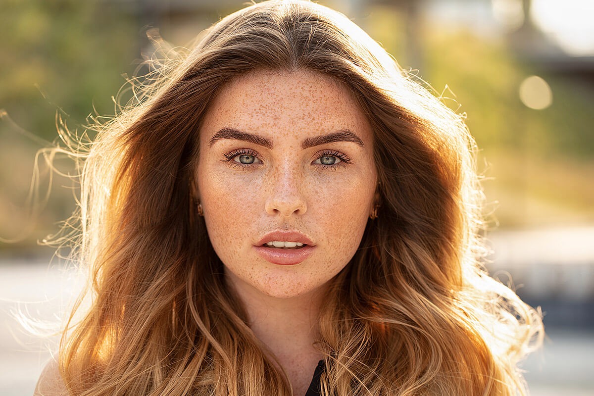 Beautiful girl with many freckles on her face