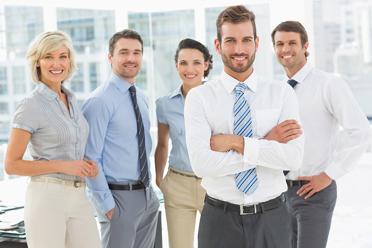 Leader in the background of his team of employees