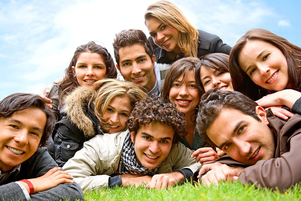 A company of people of different sexes lie on each other