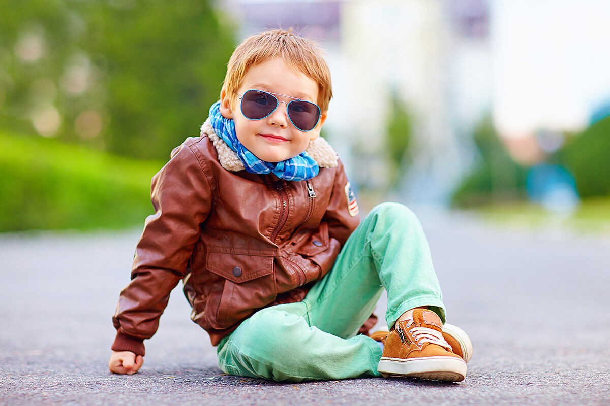 Stylish baby wearing glasses