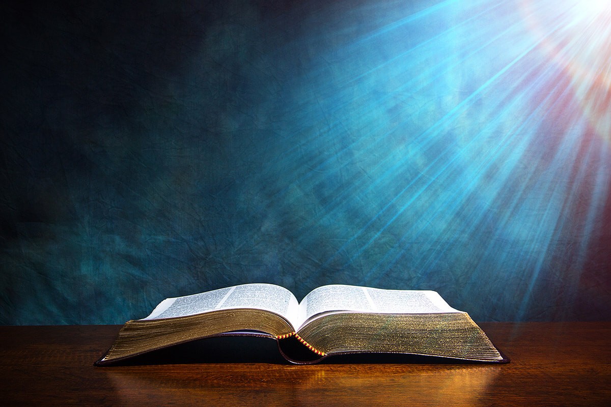 Open book with a description of religion