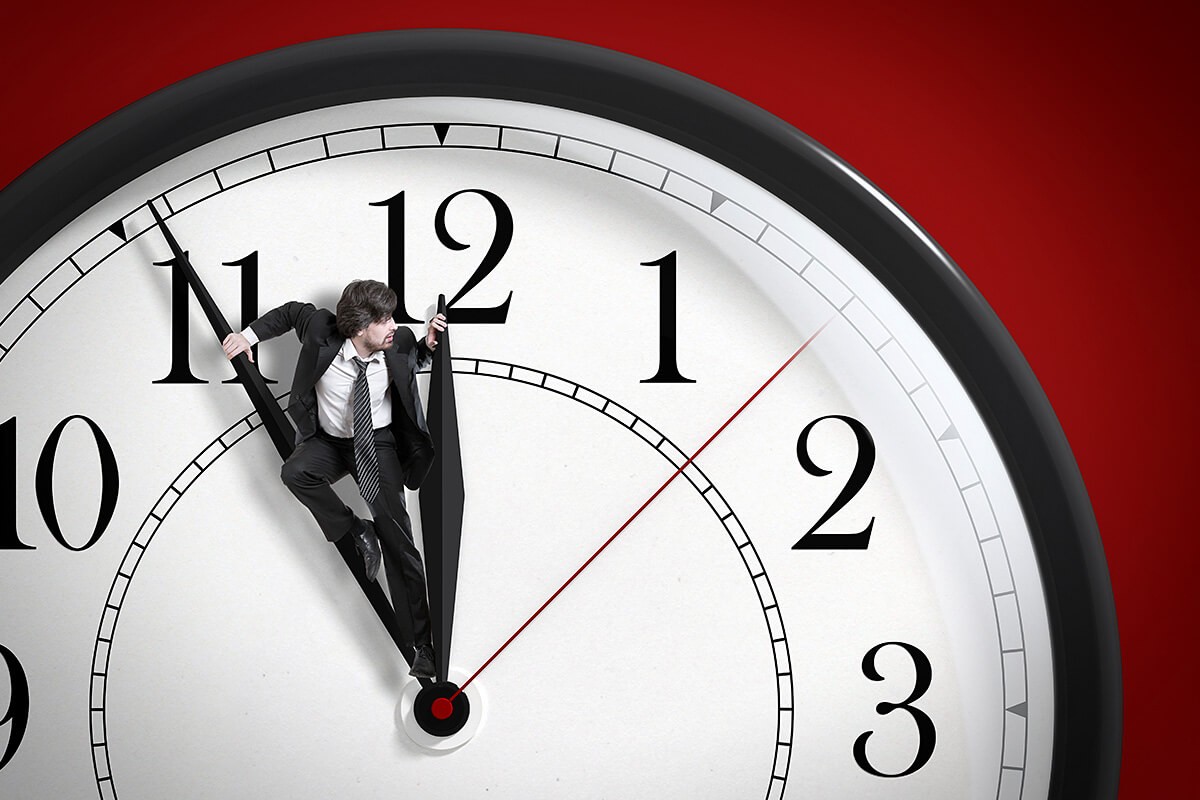The man on the big clock is trying to stop time