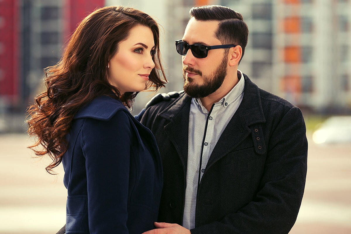 Charming man looks with passion at a girl