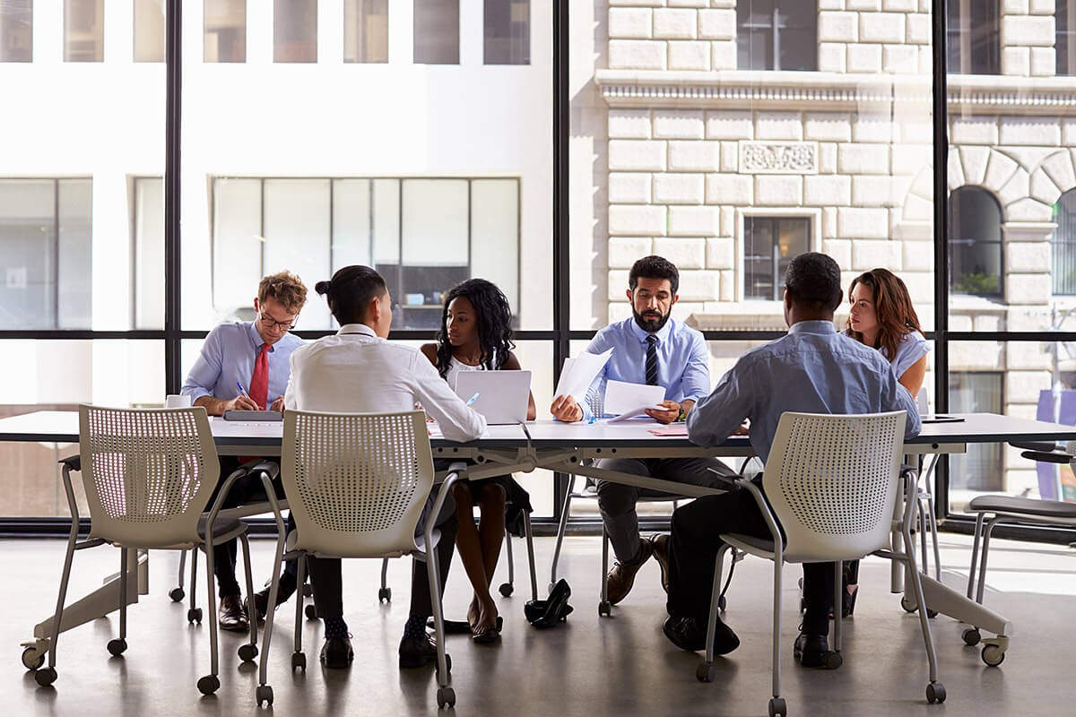 Company of people at the negotiating table Company of people at the negotiating table