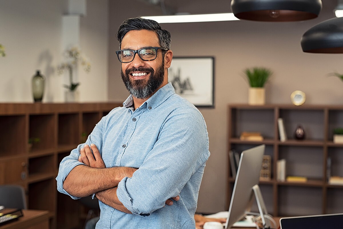 Smart man with glasses in the office Smart man with glasses in the office