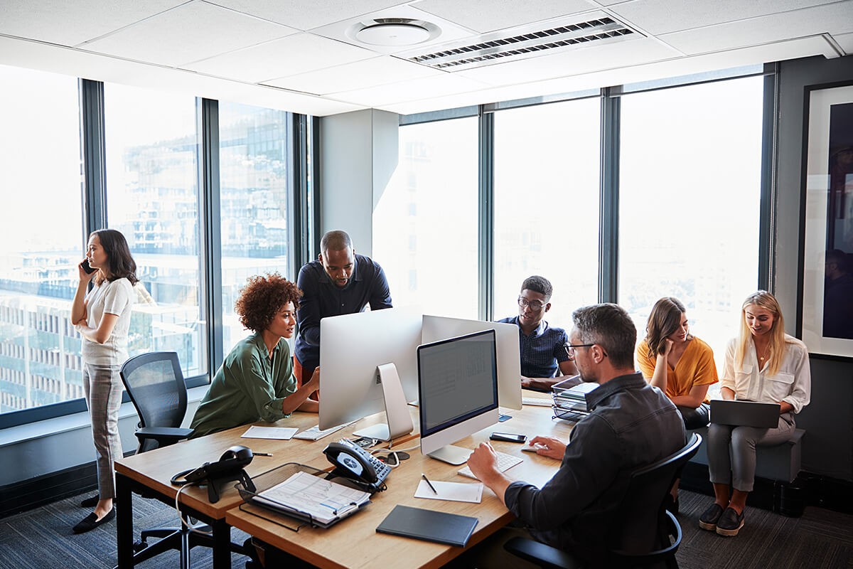 Image of a social group of people in a work office