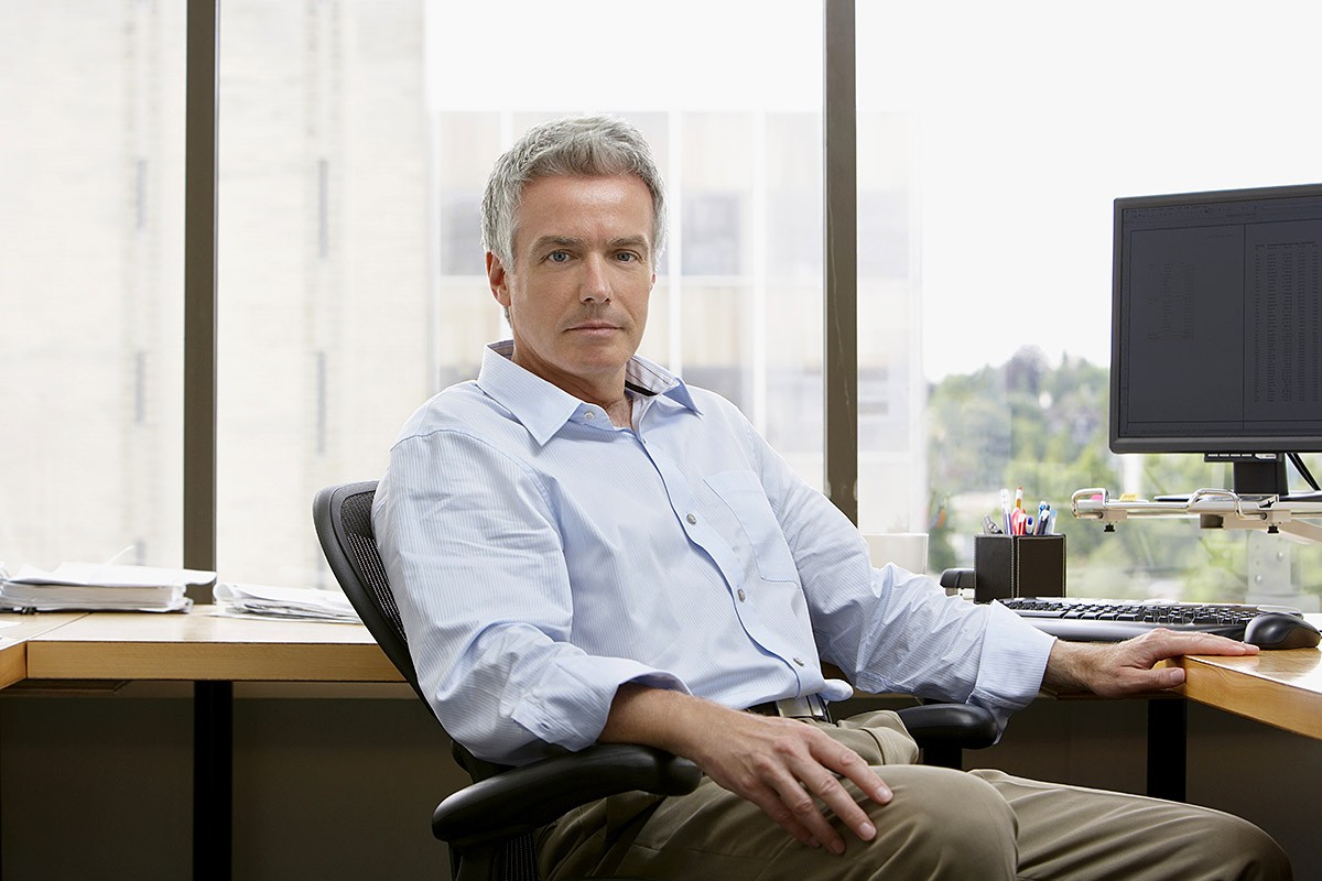 Businessman sitting at a computer