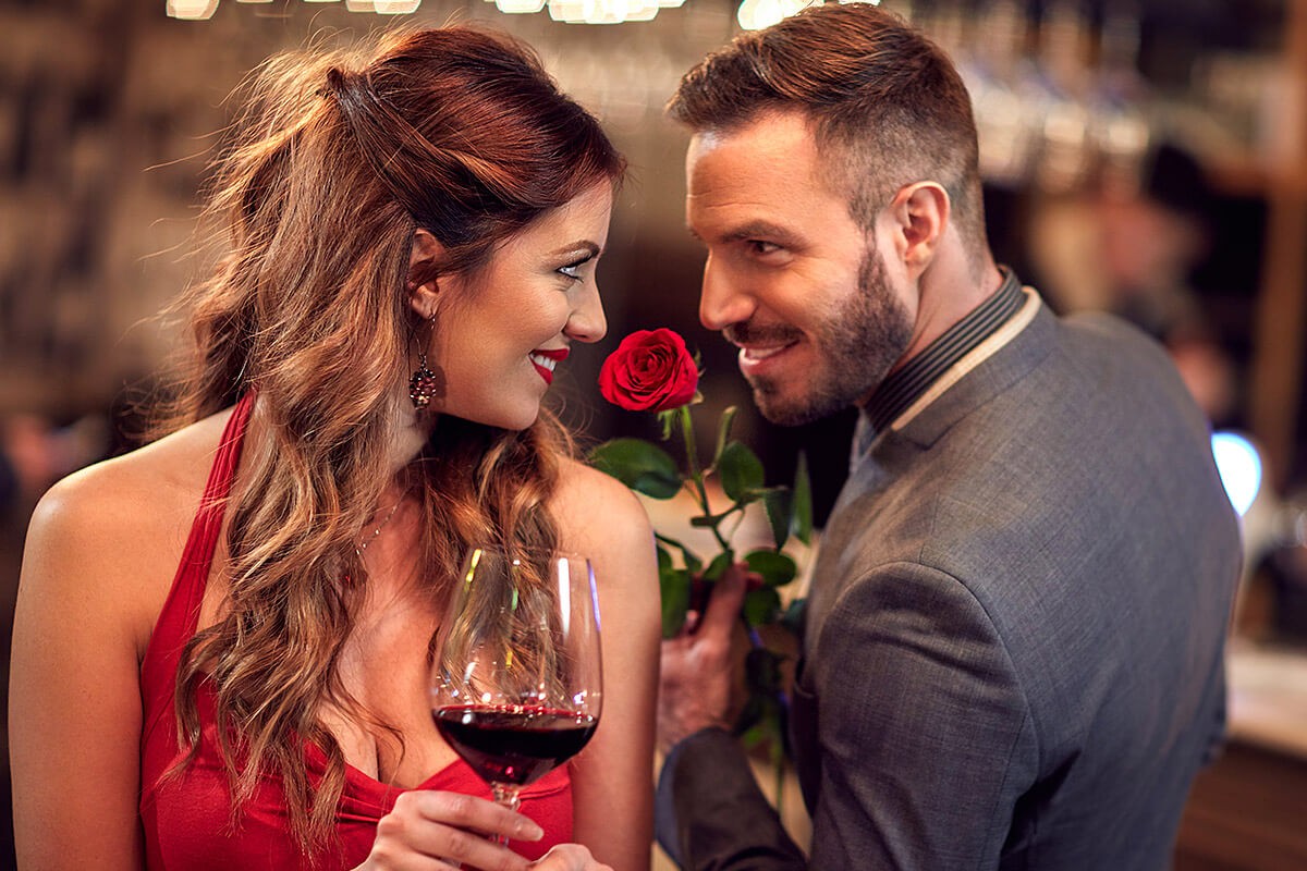 Romantic man gives a girl a flower