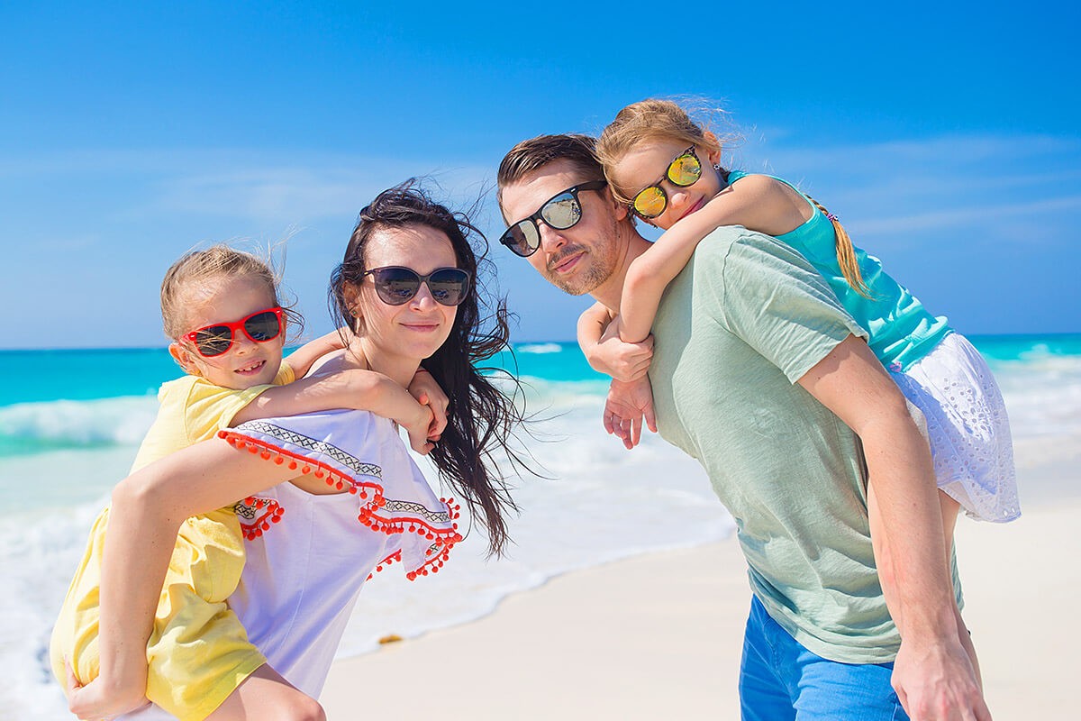 Joint pastime of children and parents at sea Joint pastime of children and parents at sea