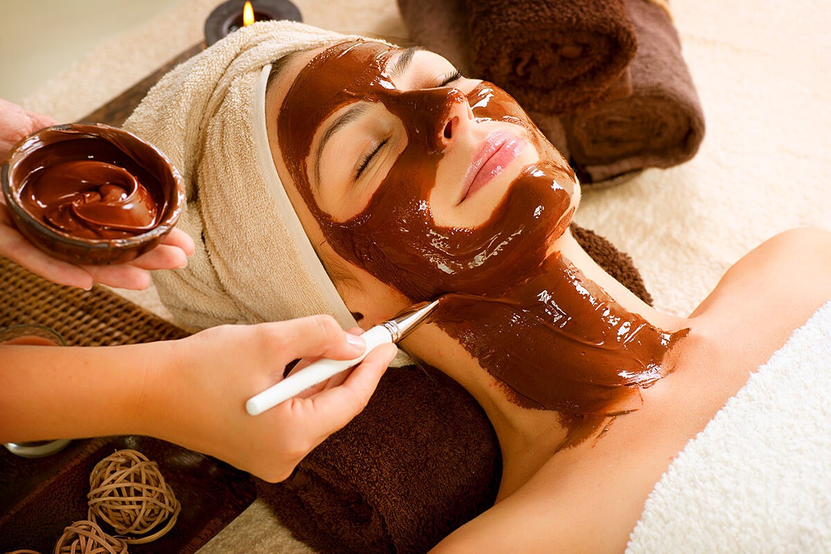 Image of a girl caring for her face and making a mask