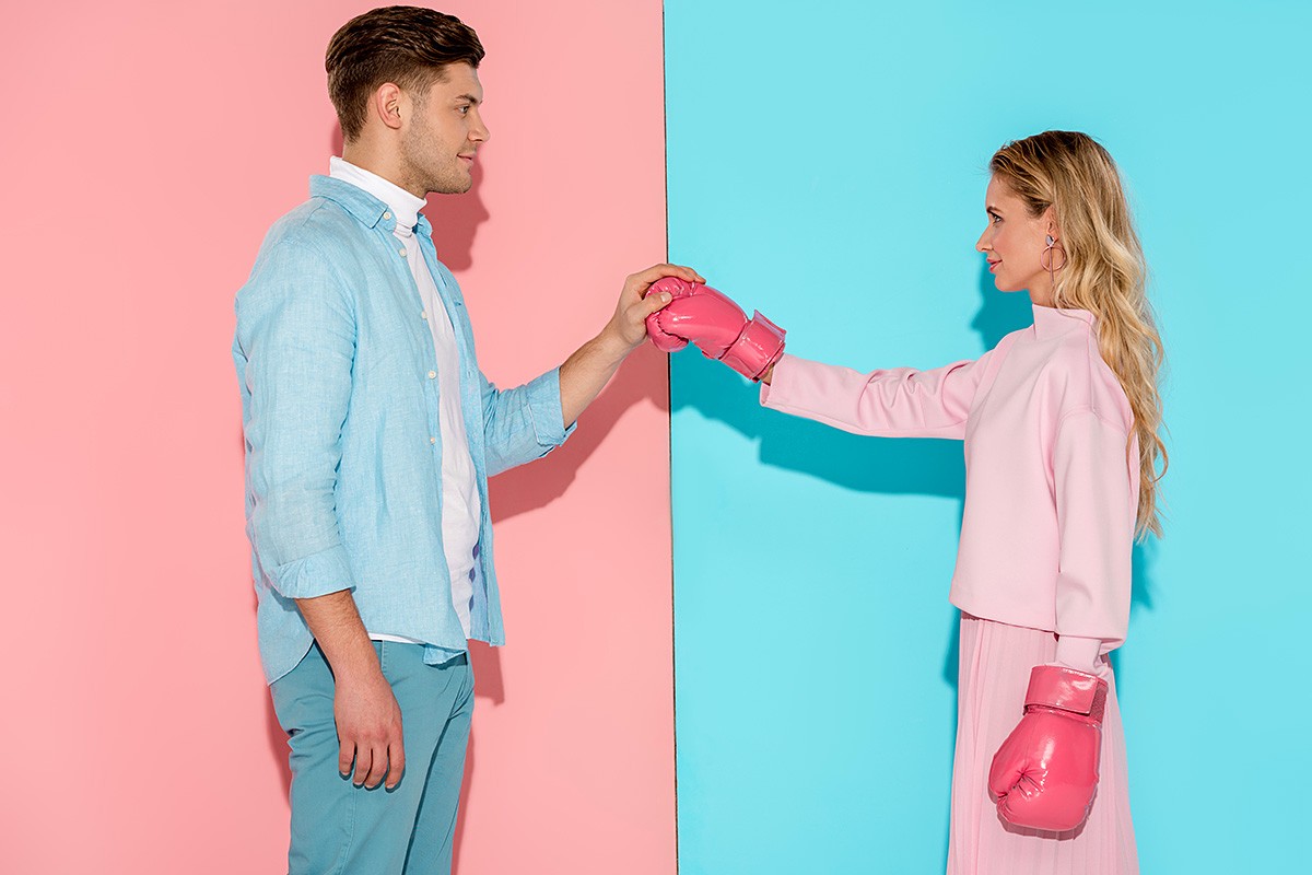 Young man and girl in boxing gloves