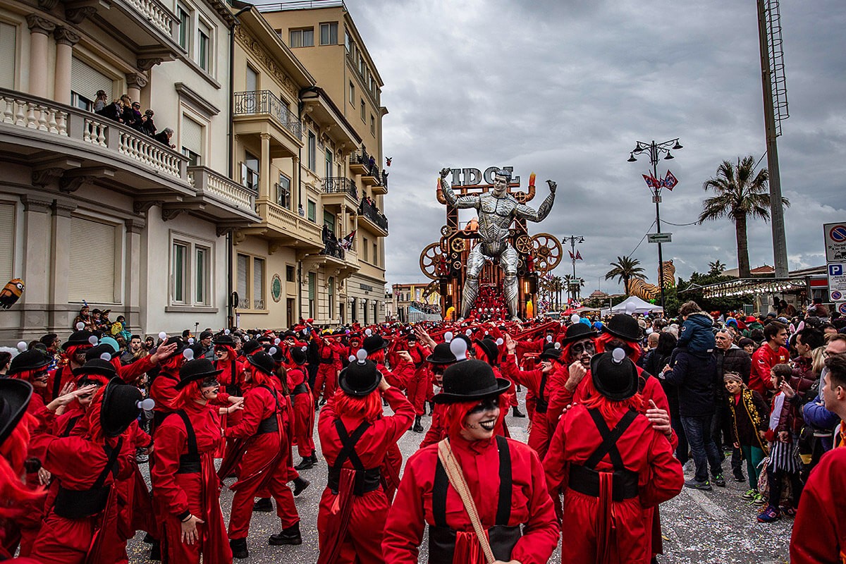View of the Parade of Carnival floats with dancing people, streets of Viareggio, Italy