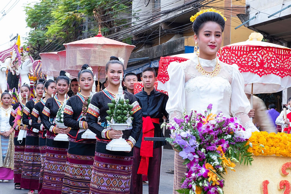 Image of young women with flowers in their hands - Annual Flower Festival Parade 2020, Chiang Mai, Thailand