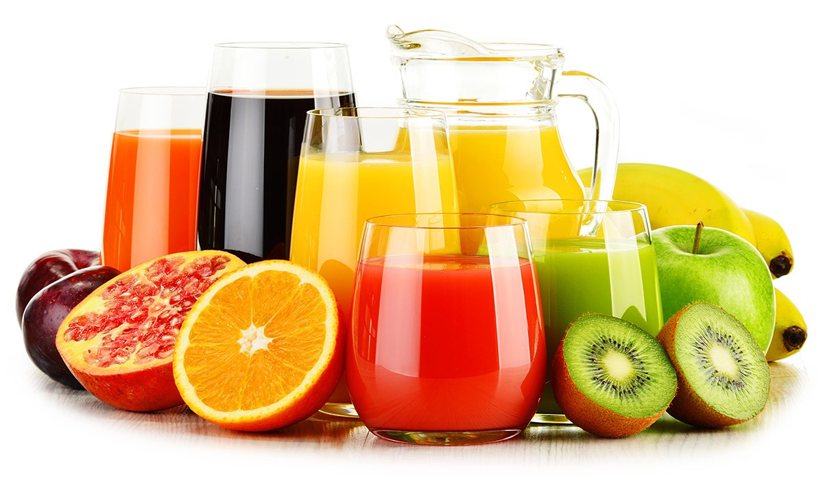 Image of fresh fruits and glasses with freshly squeezed juice