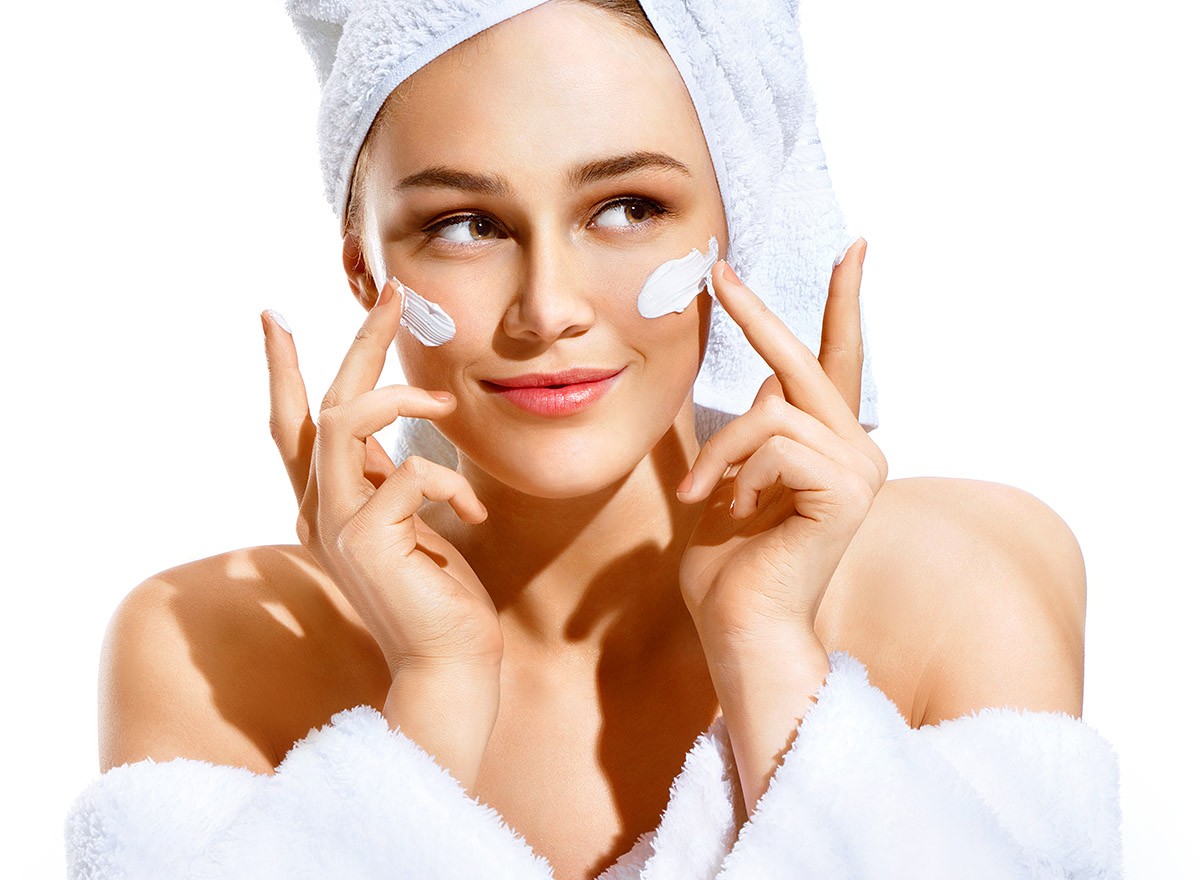 Image of a woman caring for her face
