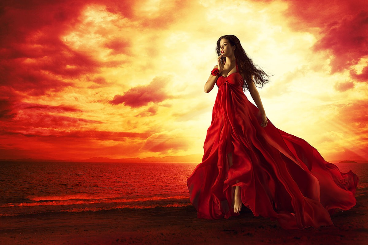 Spectacular woman walks a beautiful gait on the beach at sunset