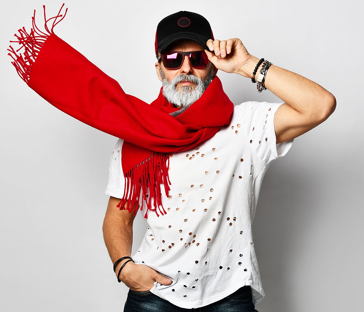 Man with glasses, a cap and a red scarf