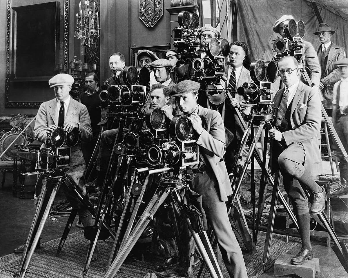 Historical image of men with old cameras