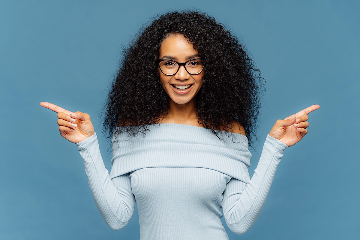 Curly pretty woman in glasses