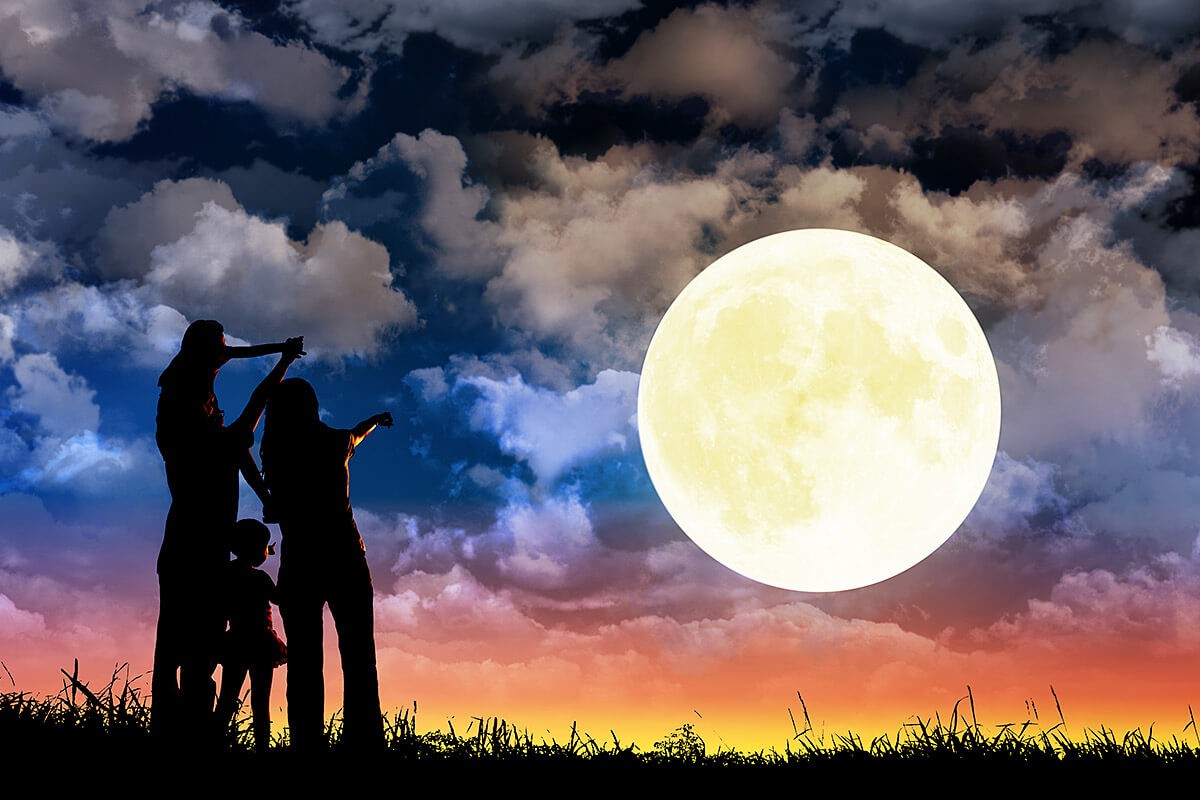 People look at the big round moon