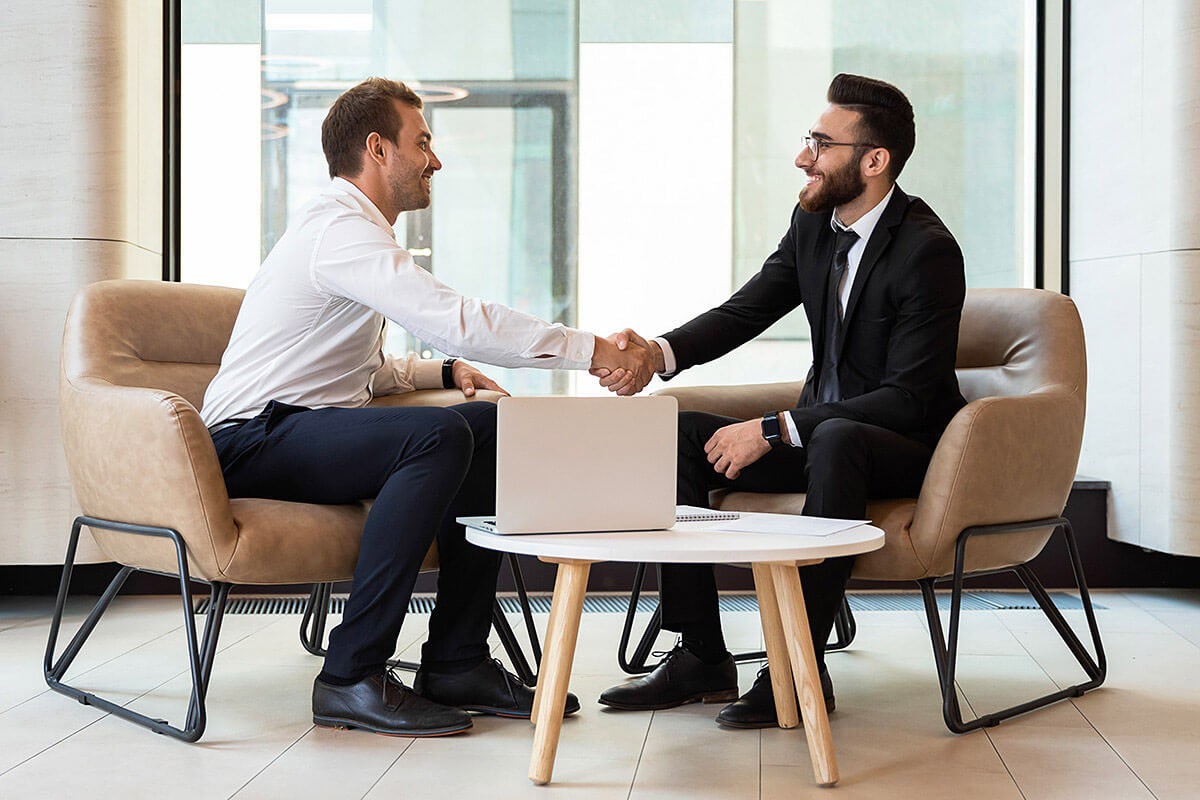 Friendly handshake of business people