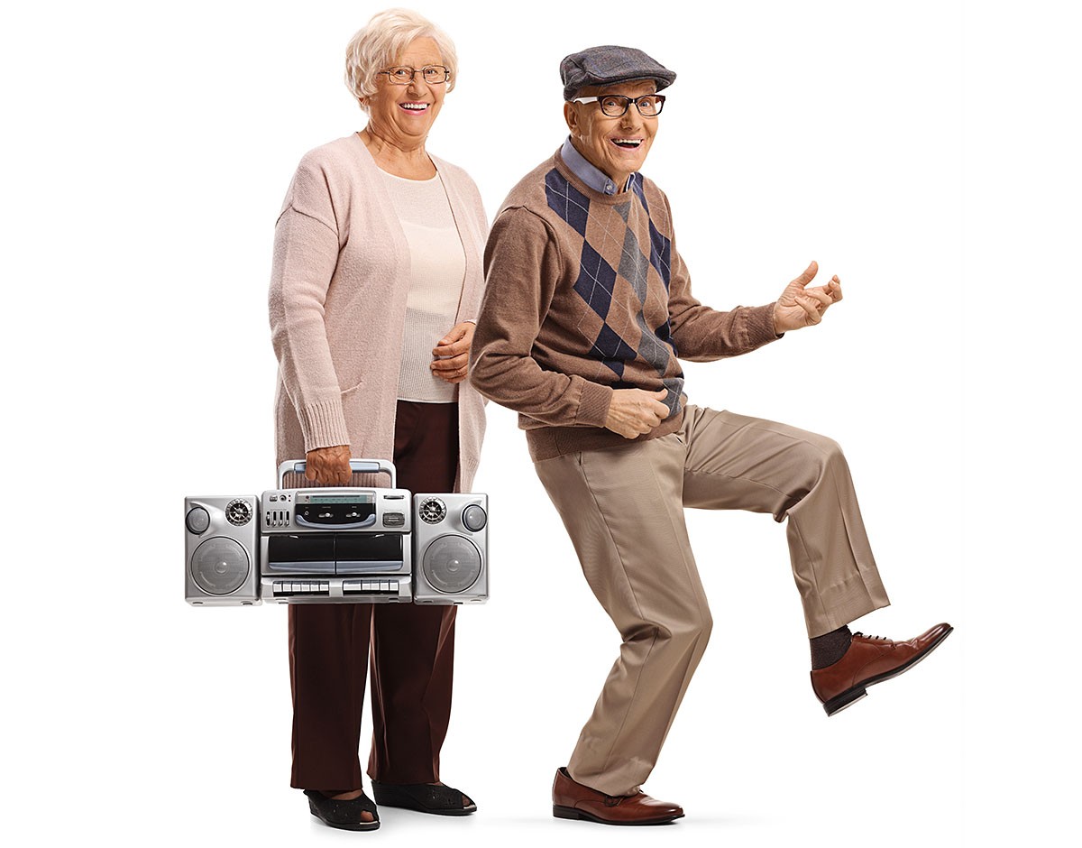 Fun elderly couple with a tape recorder