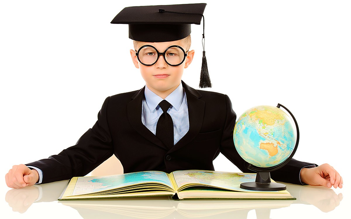 Young man with magazine and globe gets an education