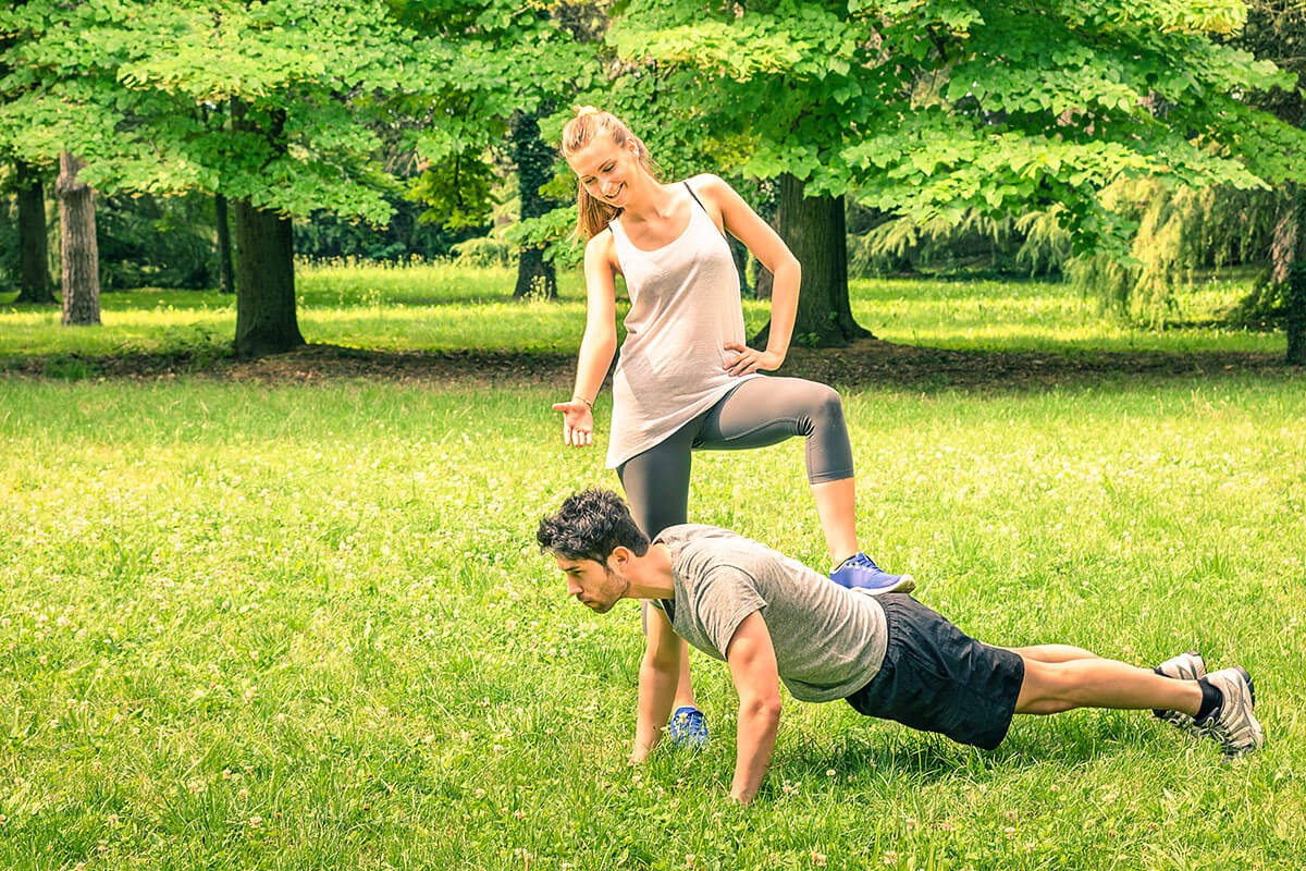 A man and a woman are engaged in sports