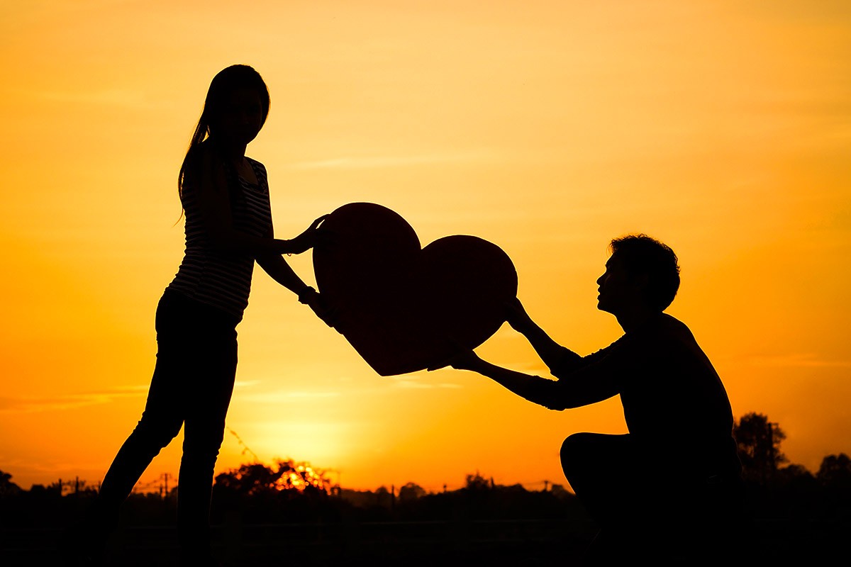 Image of a couple in love at sunset