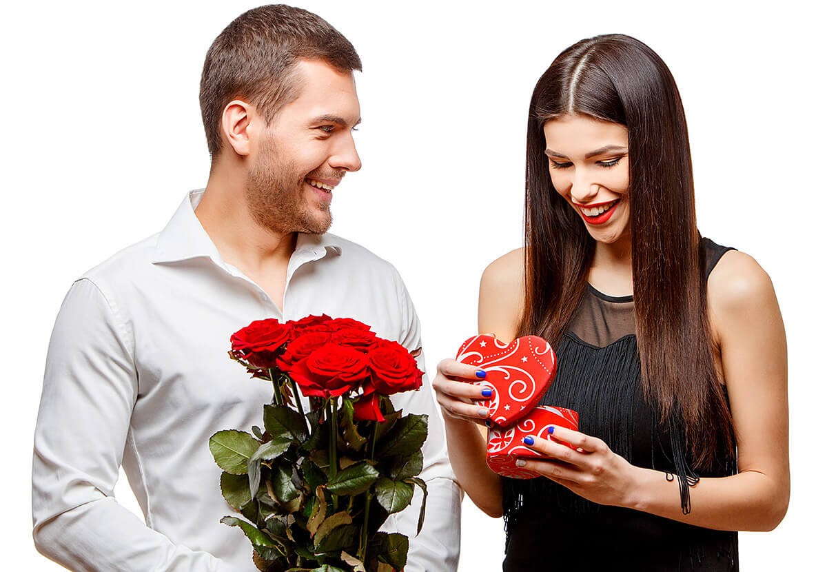 Loving man gives his woman flowers and a present