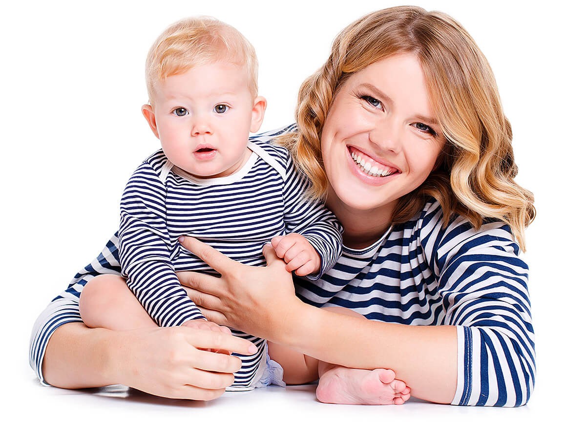 Happy mom plays with her baby