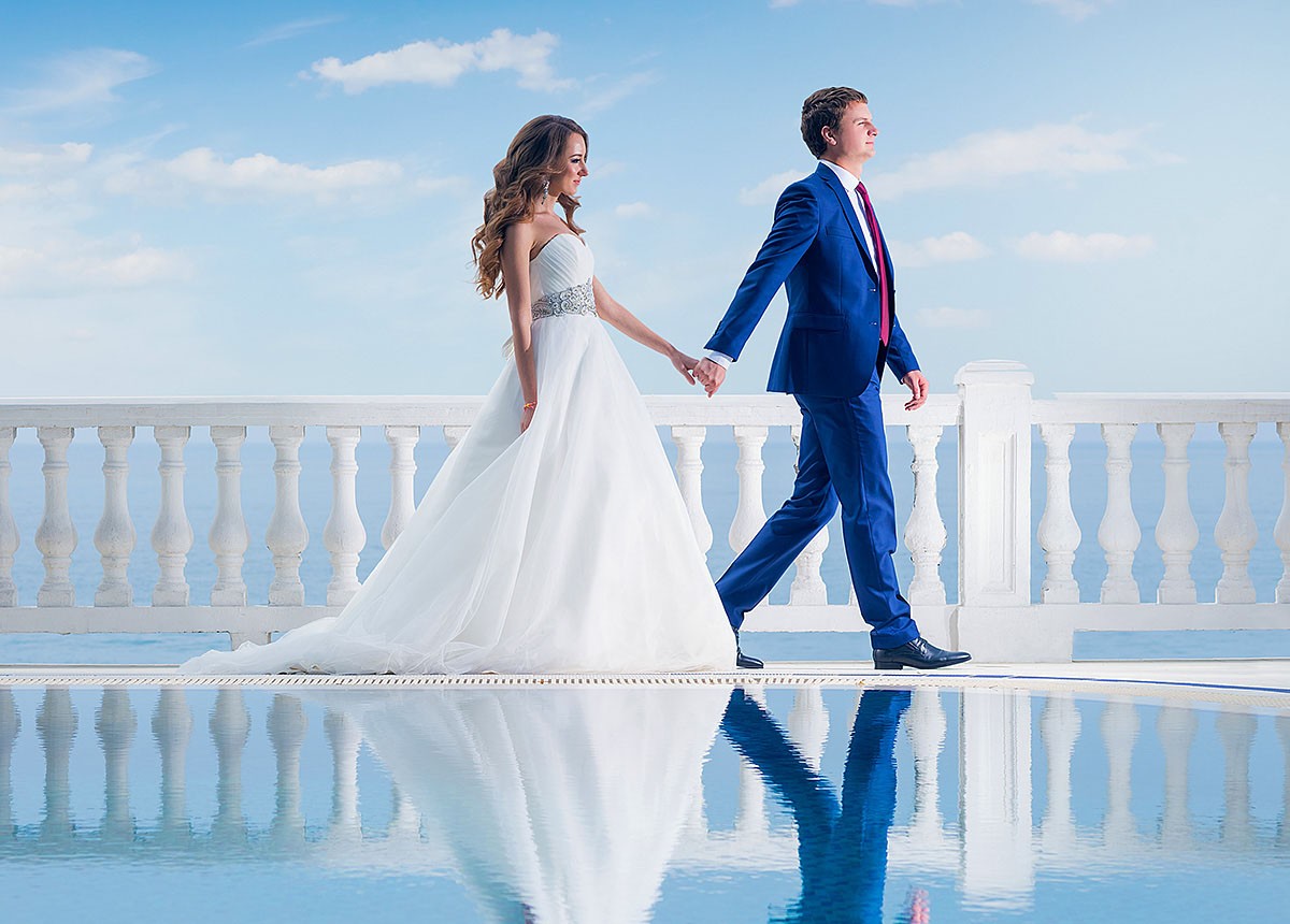 Young woman in a wedding dress and her man
