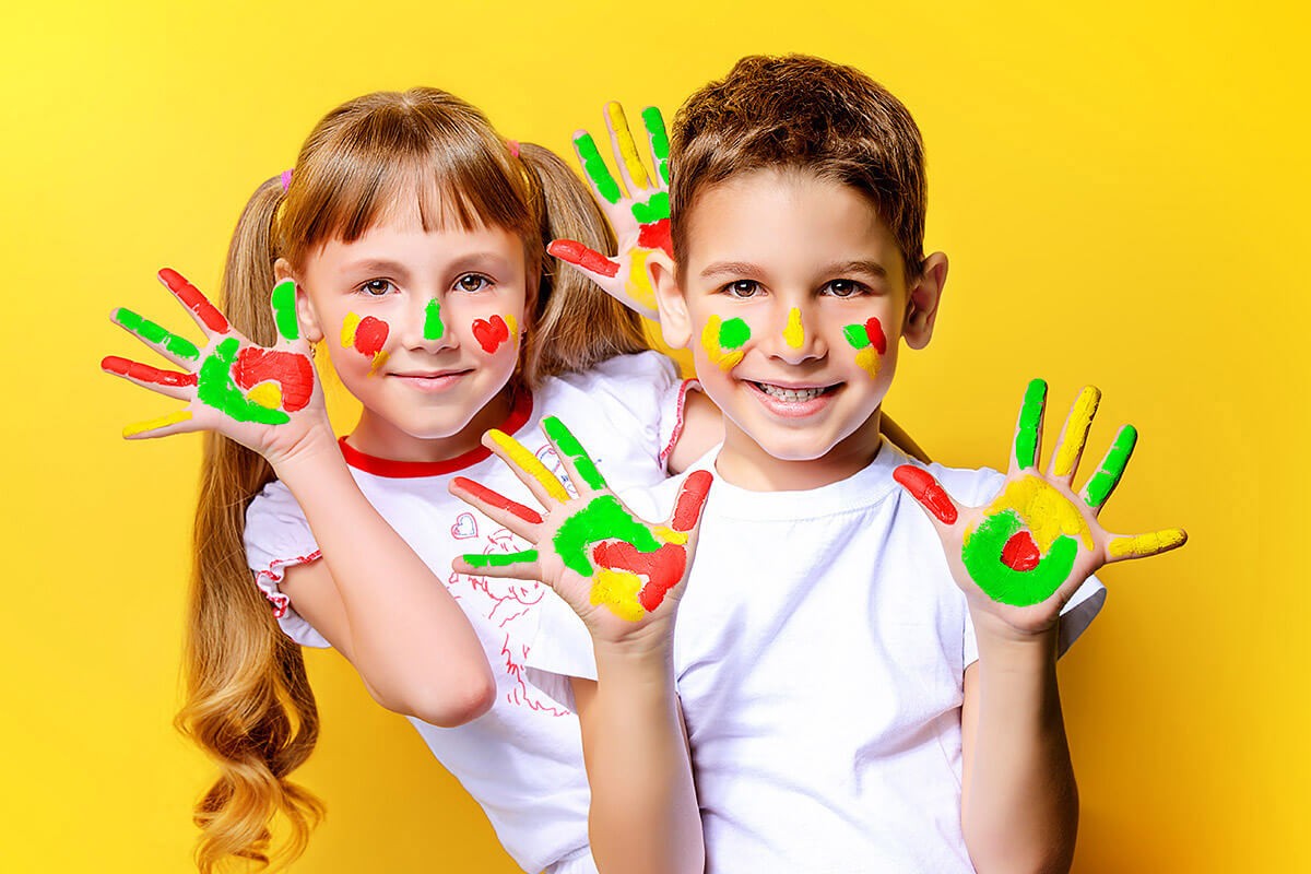 Image of children playing with paint