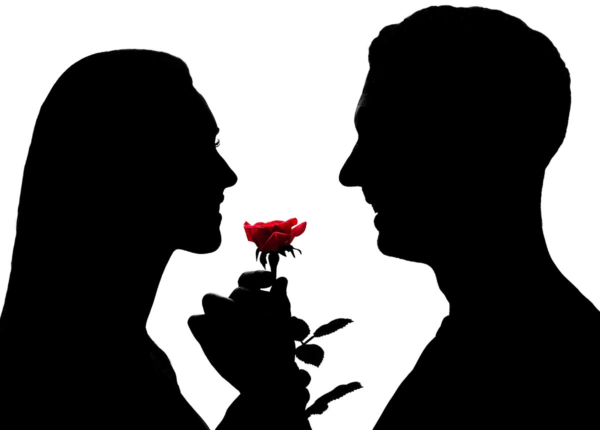 Image of a man in love who gives a red flower to his woman
