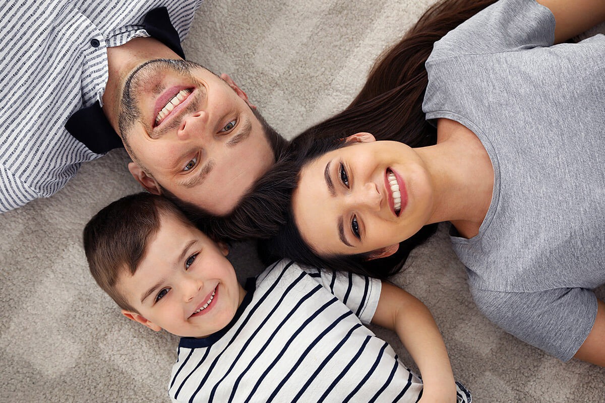 Image of happy parents and their child