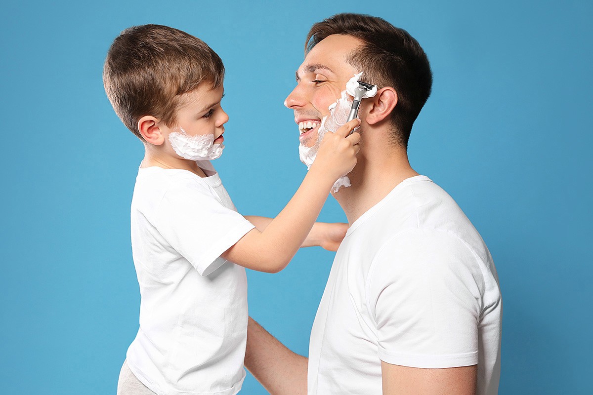 Image of son and father shaving together