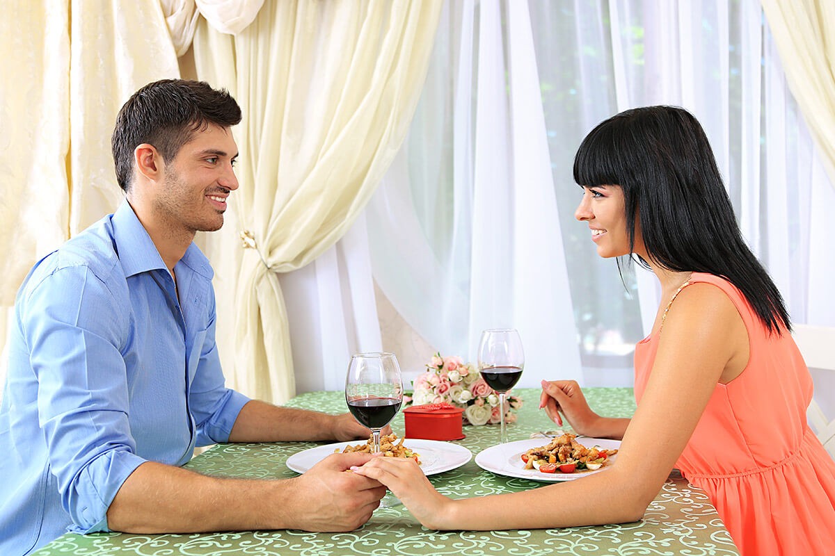 Young man and girl are talking nicely on a first date