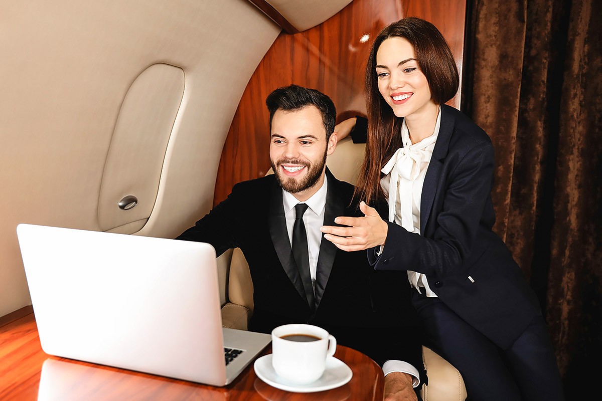 Man and woman politely communicate in an airplane Man and woman politely communicate in an airplane