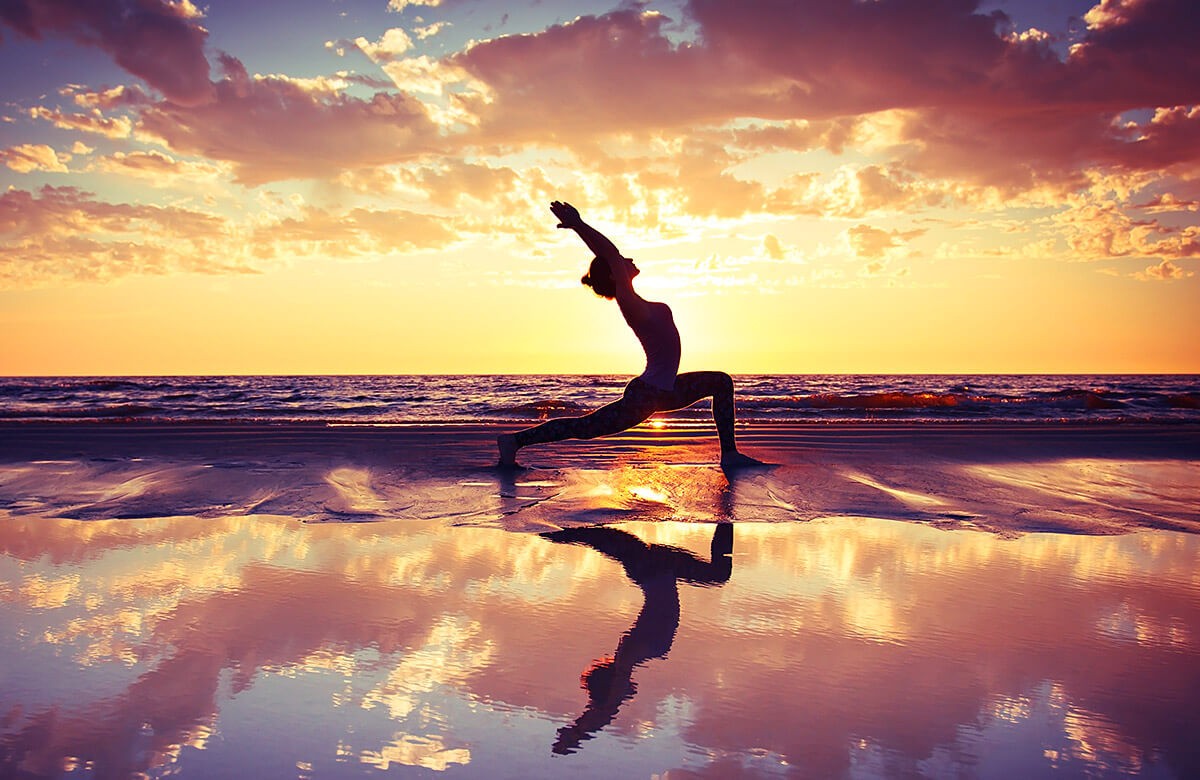 Woman goes in for sports at sunset by the sea Woman goes in for sports at sunset by the sea