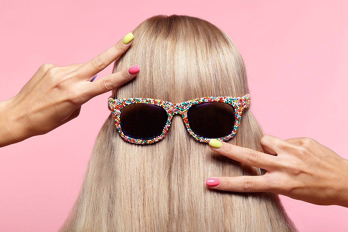 Image of beautifully dyed female hair and sunglasses Image of beautifully dyed female hair and sunglasses