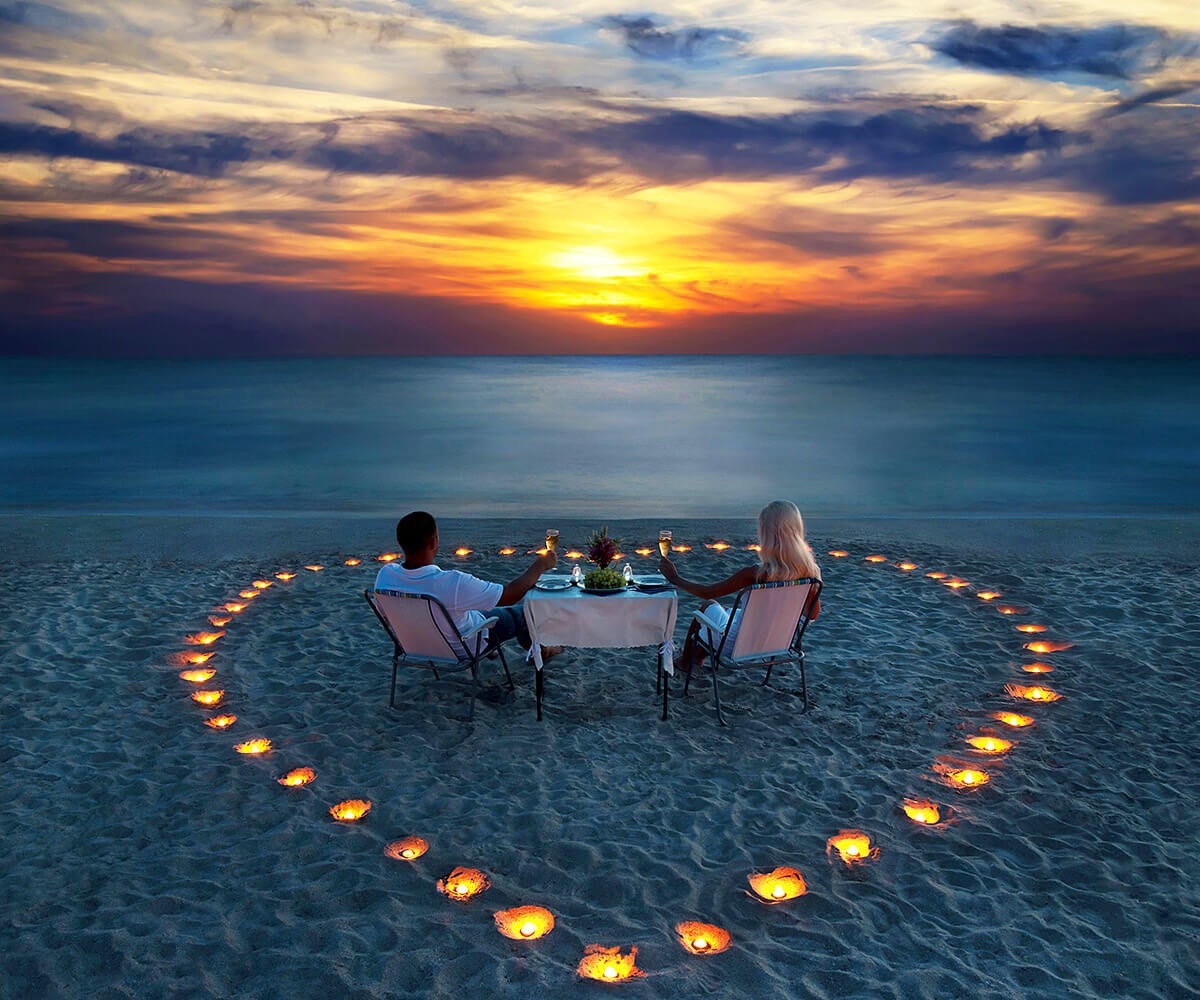 Romantic evening dinner of a married couple by the sea
