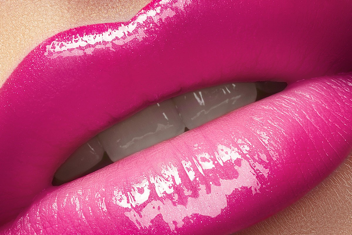 Image of attractive female lips with bright pink lipstick Image of attractive female lips with bright pink lipstick