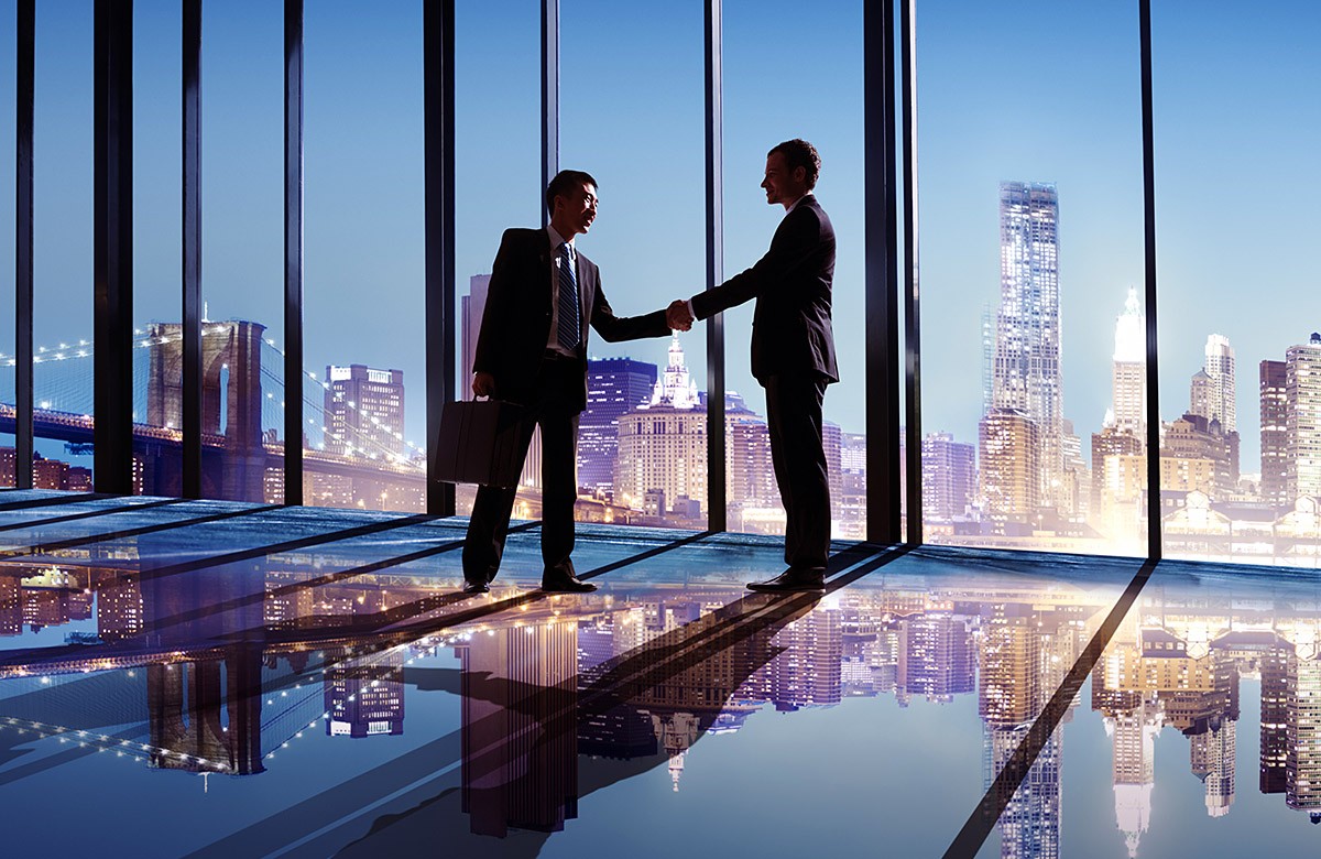 Image of business people shaking hands in the office