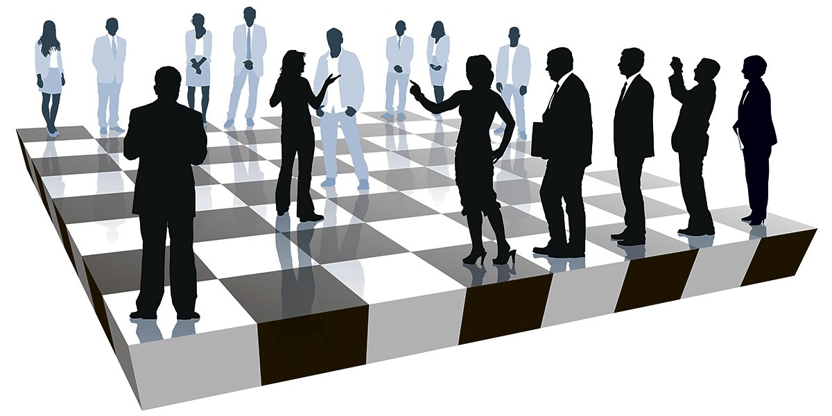 Image of figures of people on a chessboard Image of figures of people on a chessboard