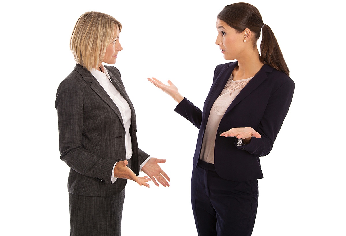 Image of two women talking in raised tones